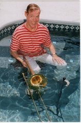 Roy Wiegand in the pool with his trombone